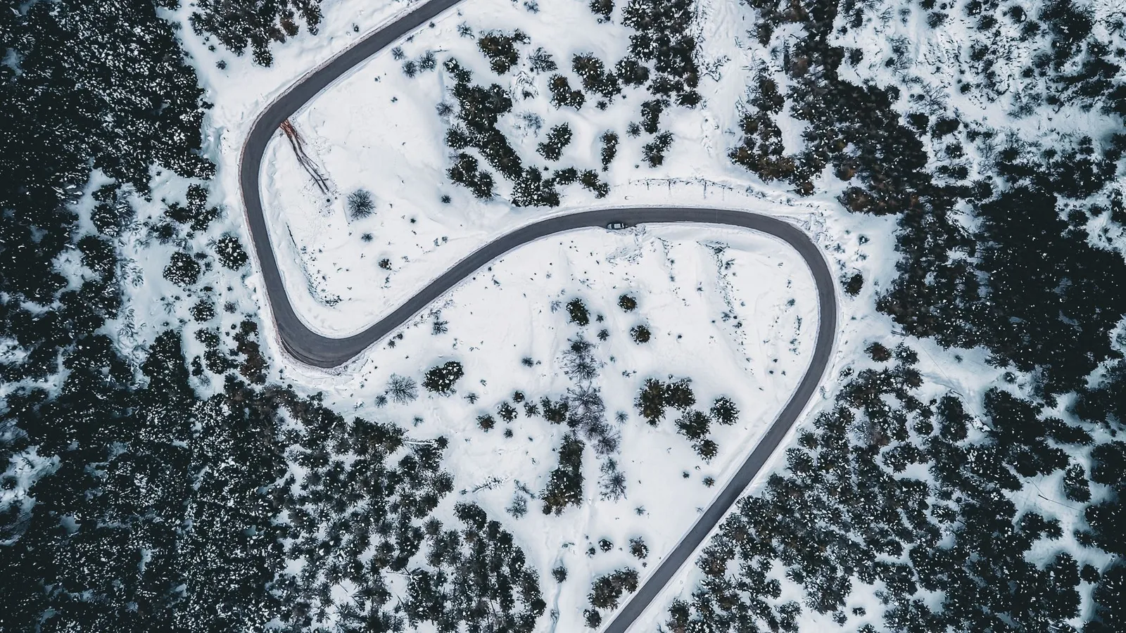 Winding winter road through the snowy Bolu forest on the way to Kartalkaya