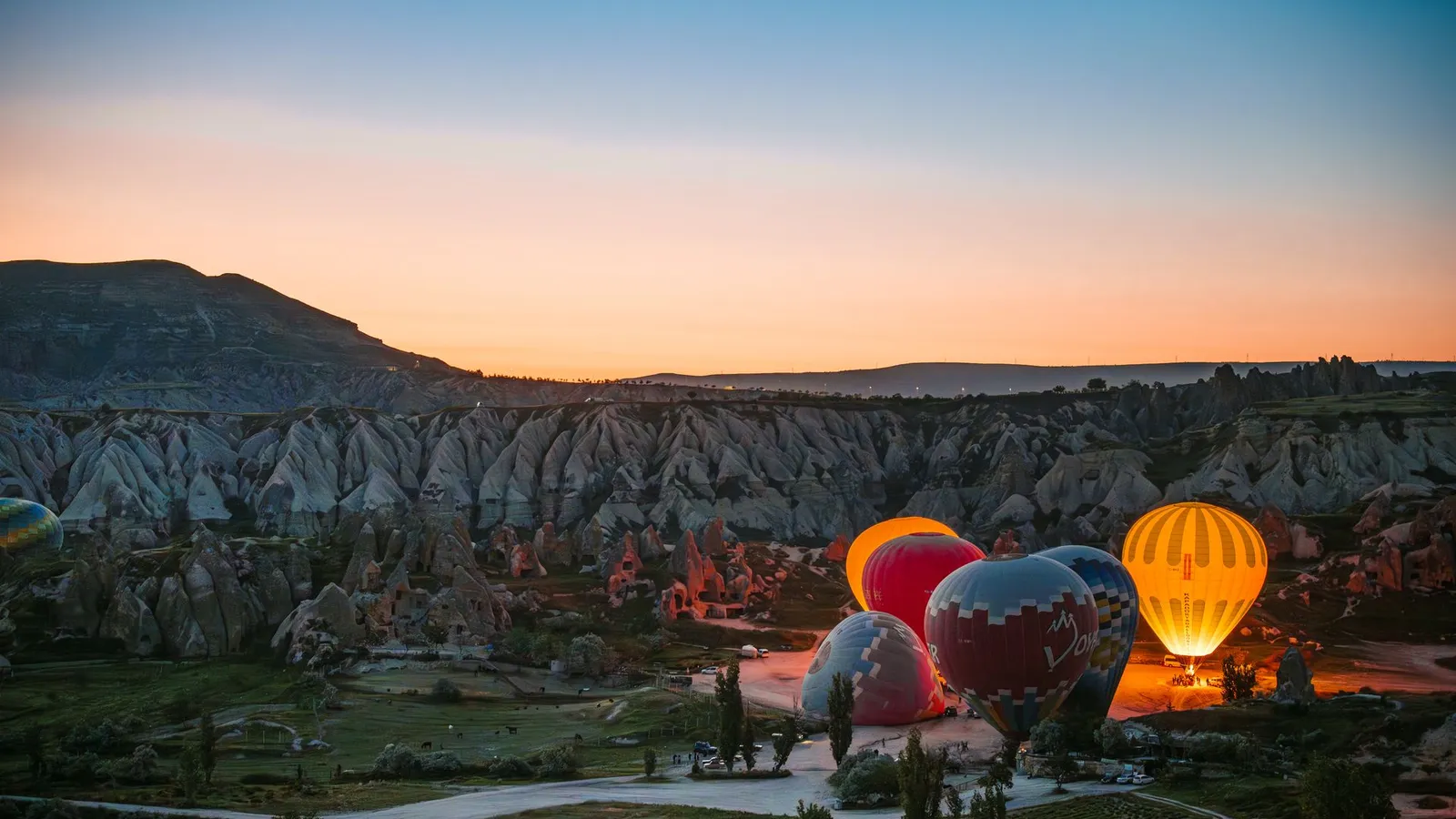 Hot air balloons over Cappadocia at sunrise