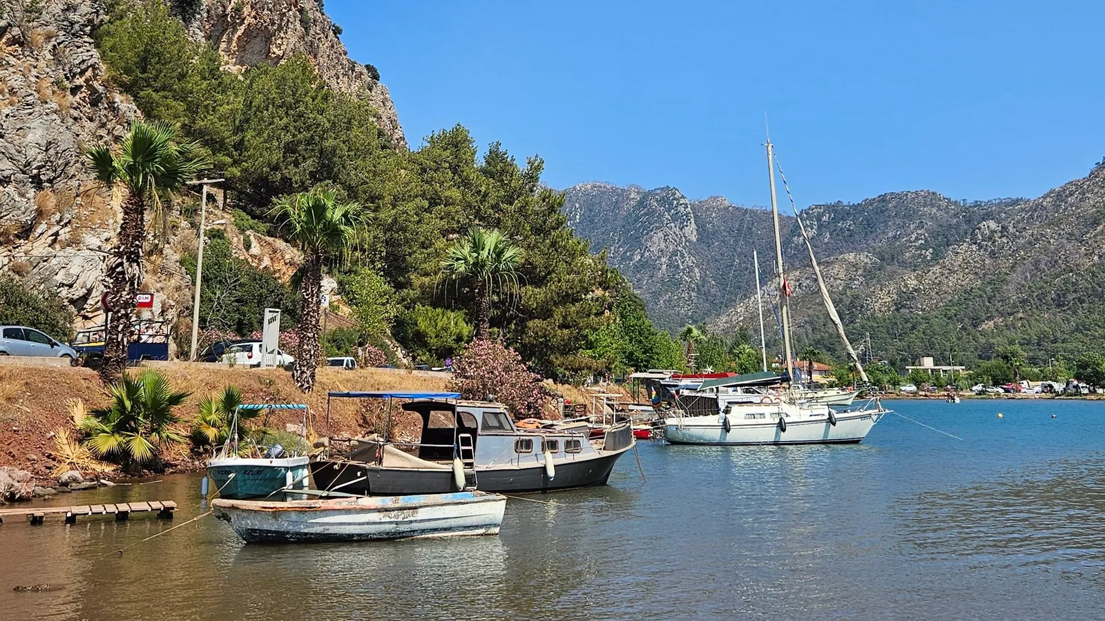 Boats in Marmaris marina with rocky mountains behind
