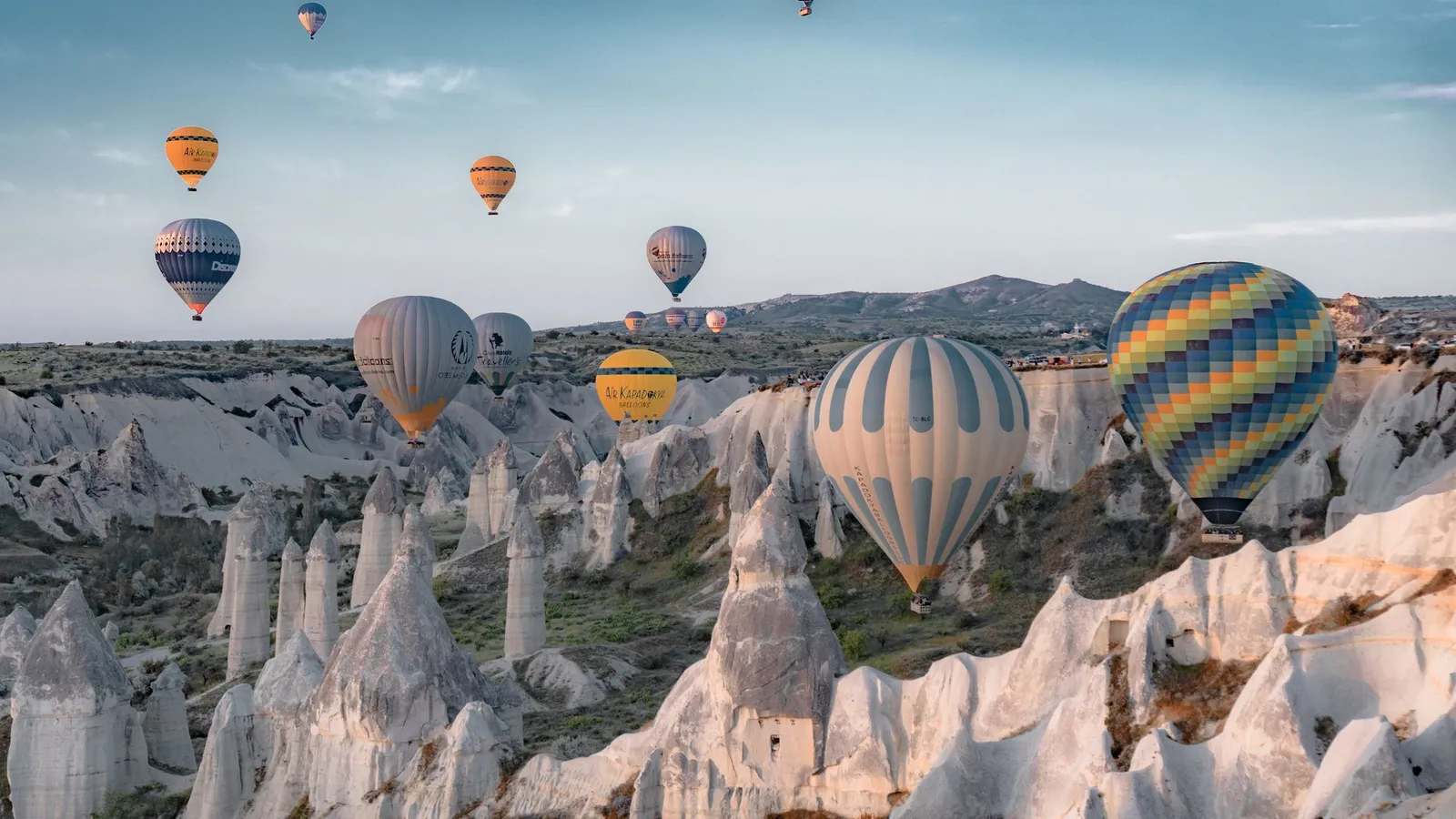 Hot air balloons floating over the fairy chimneys of Goreme, Cappadocia