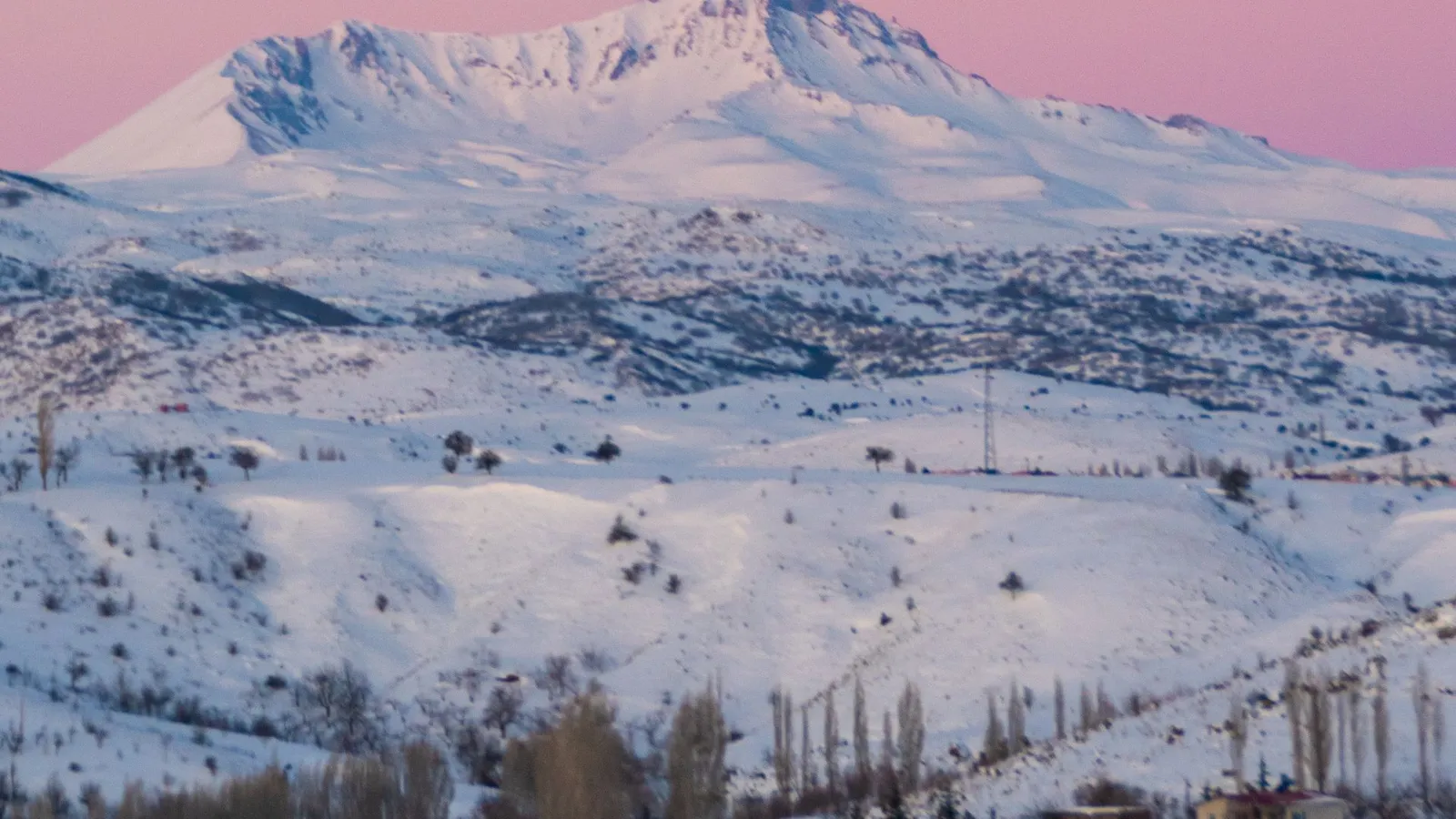 Snow-capped Mount Erciyes rising above Kayseri at sunrise
